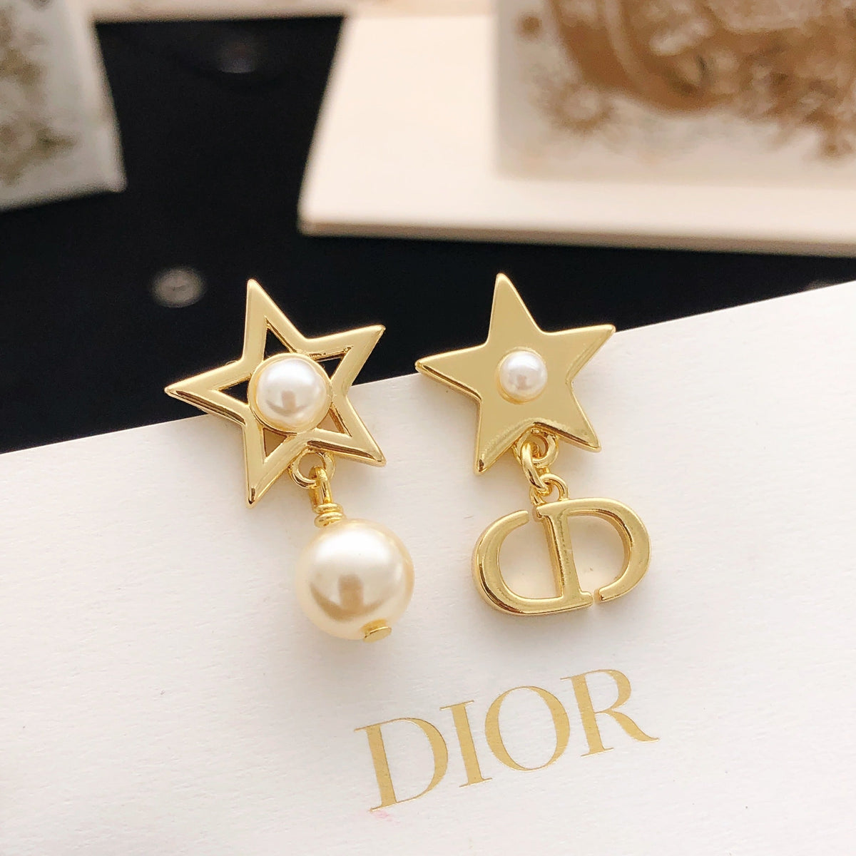 Martin Graham stud earrings in polished metal-tone