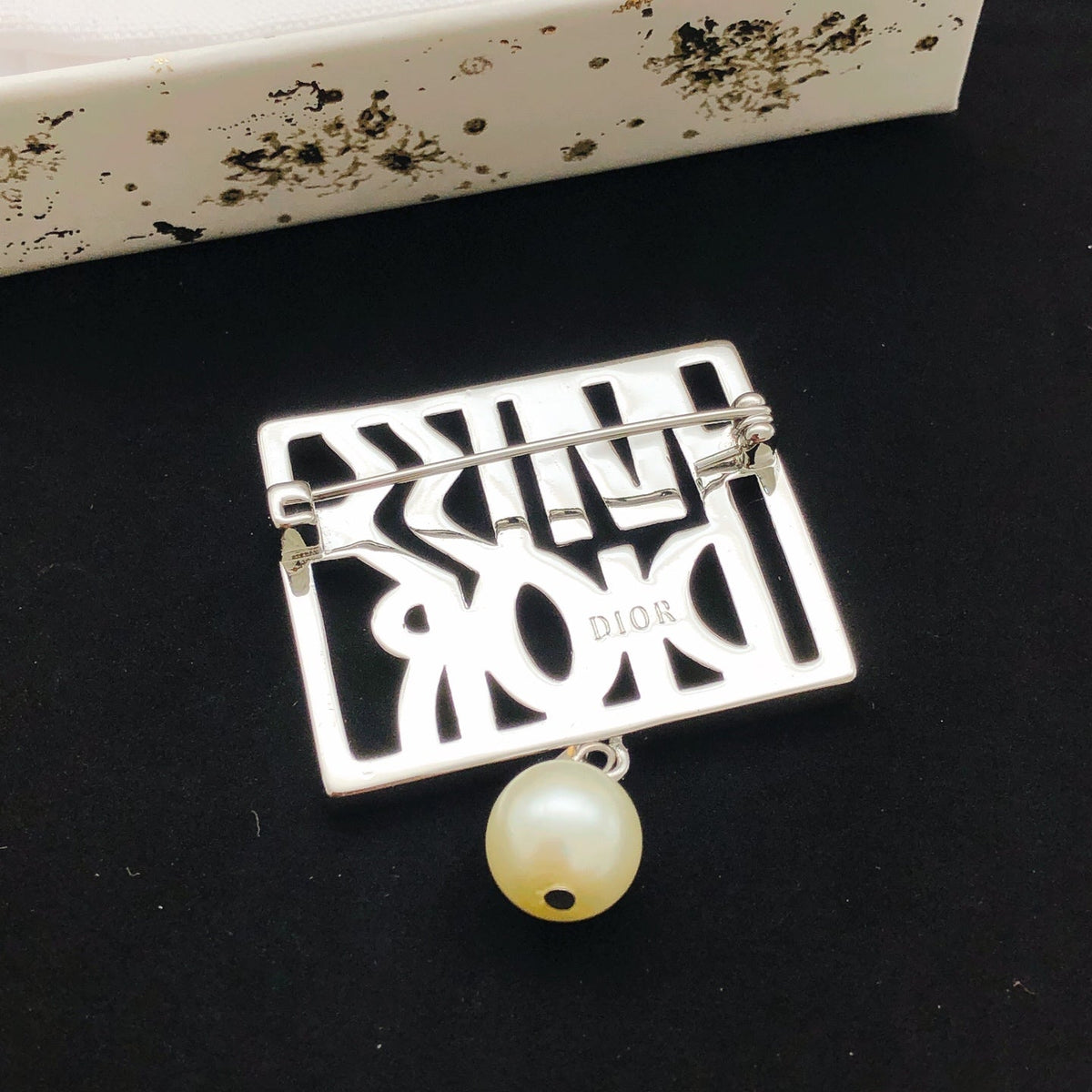 Martin Graham brooch in polished metal-tone