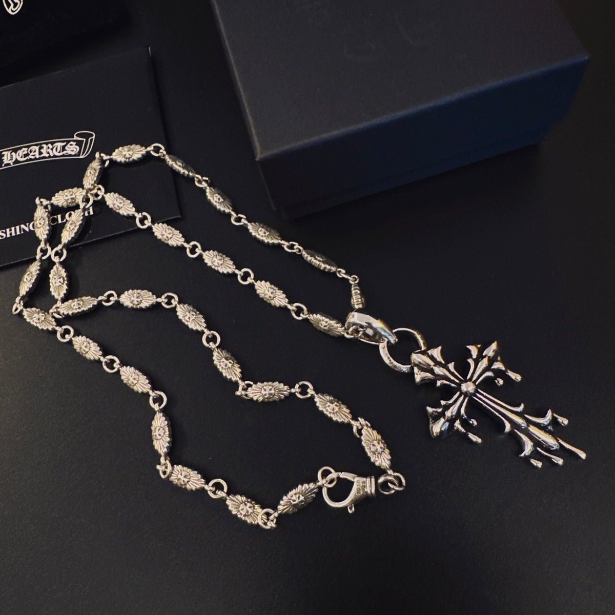 Martin Graham pendant necklace in polished metal-tone – close-up detail