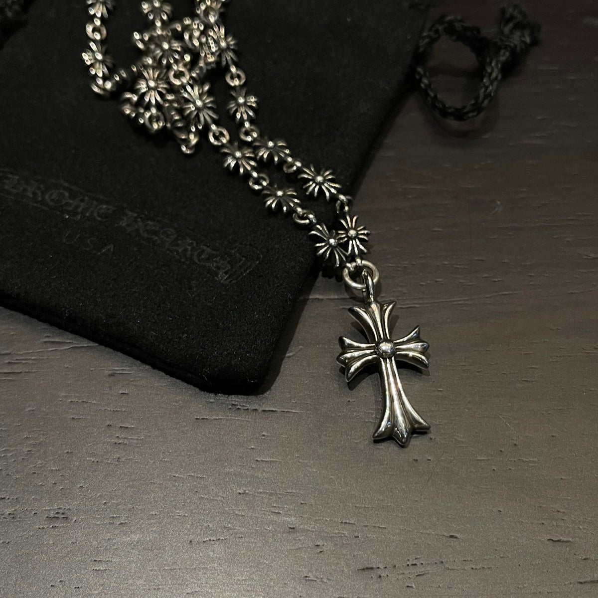 Martin Graham pendant necklace in polished metal-tone – close-up detail