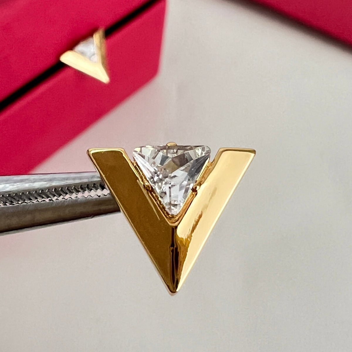 Martin Graham stud earrings in polished metal-tone