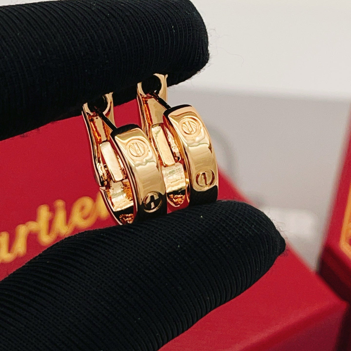 Martin Graham stud earrings in polished metal-tone