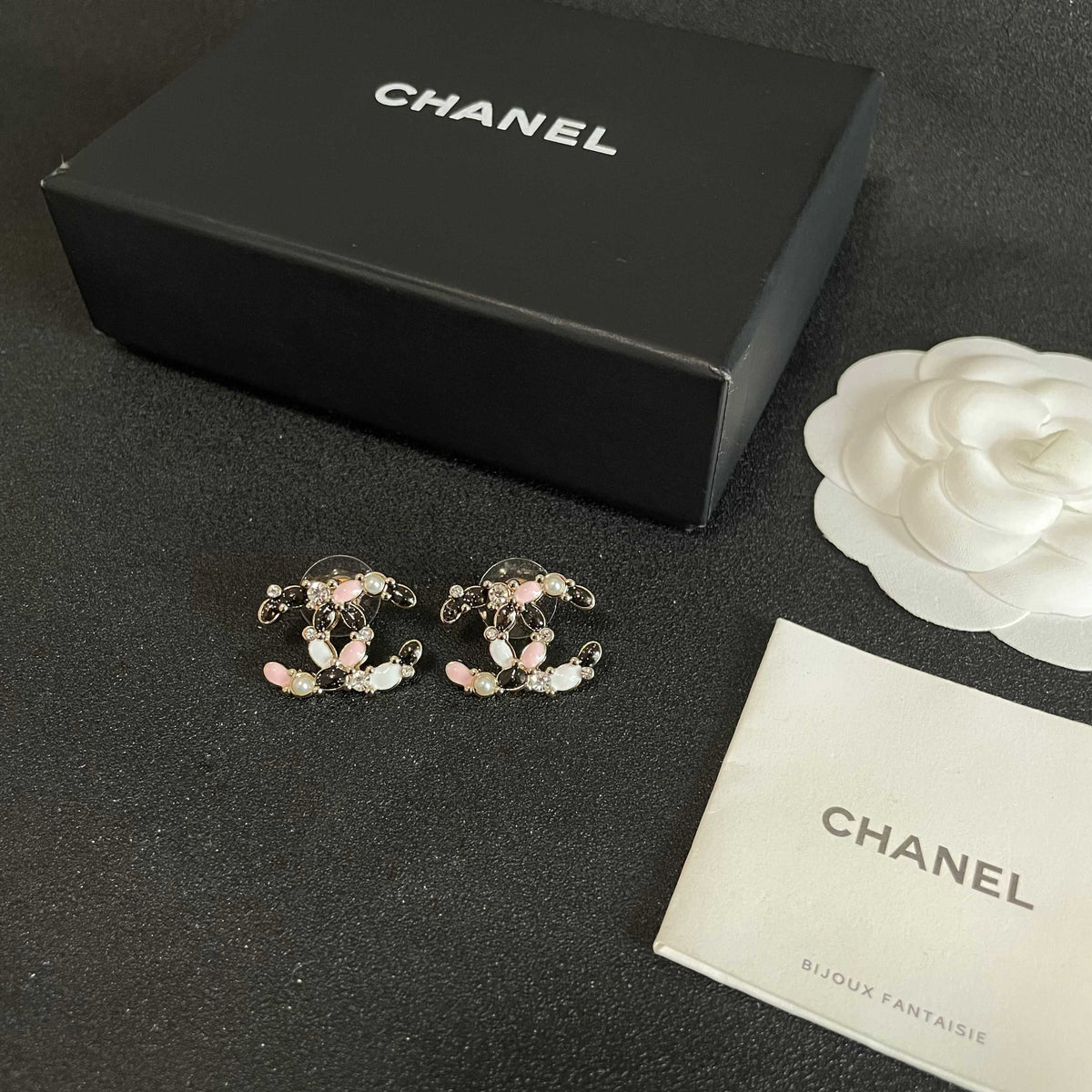 Martin Graham stud earrings in polished metal-tone – close-up detail