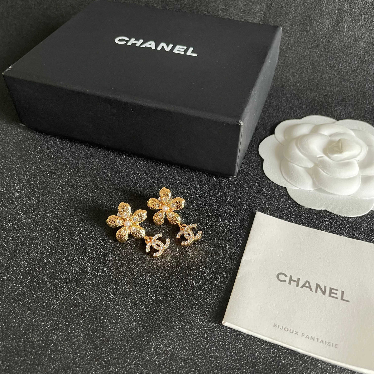 Martin Graham stud earrings in polished metal-tone – close-up detail