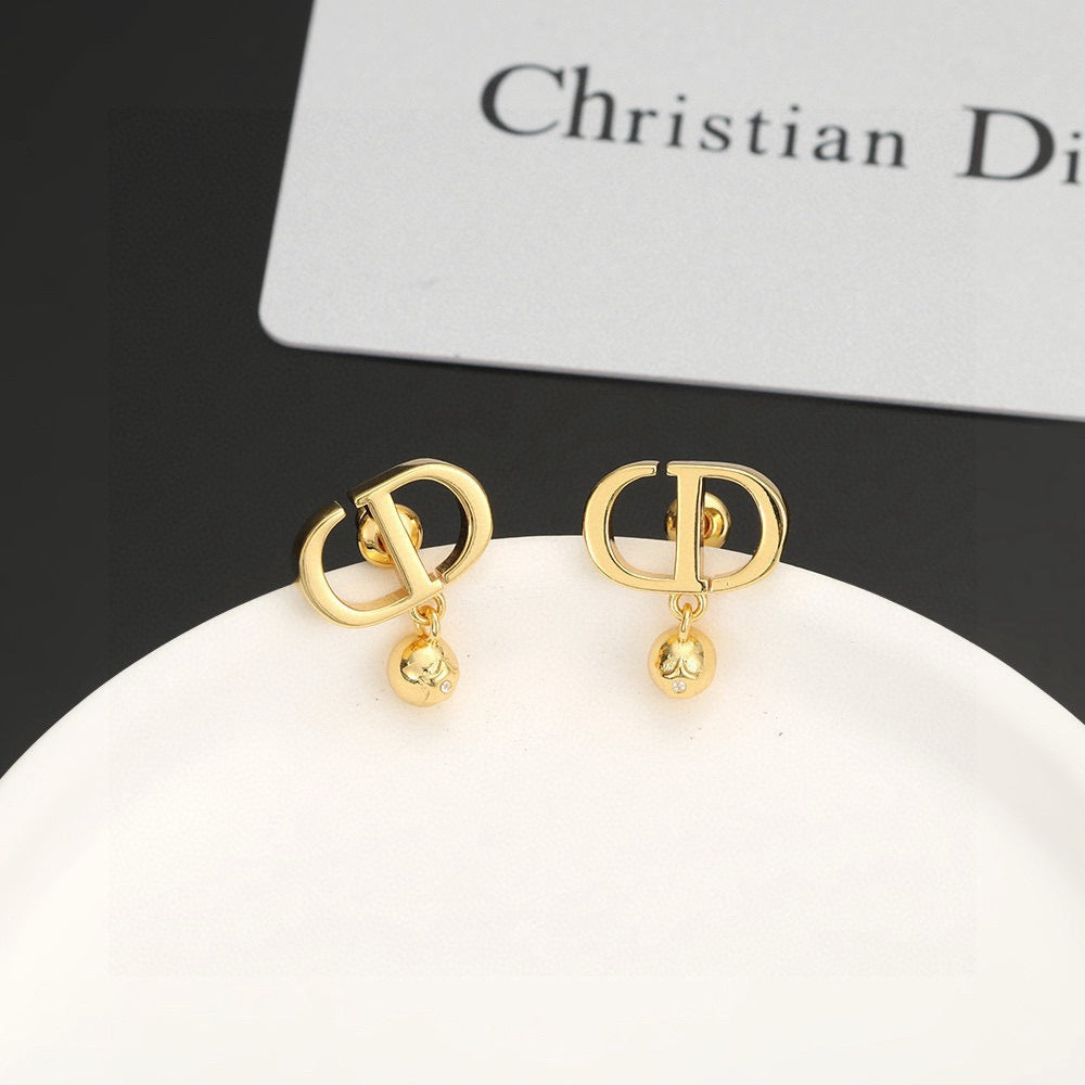 Martin Graham earrings in polished metal-tone