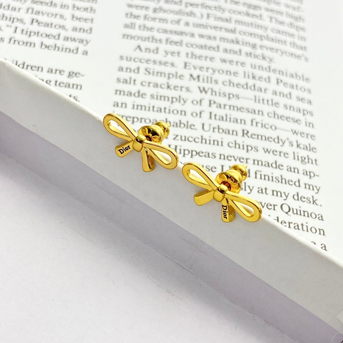 Martin Graham stud earrings in polished metal-tone