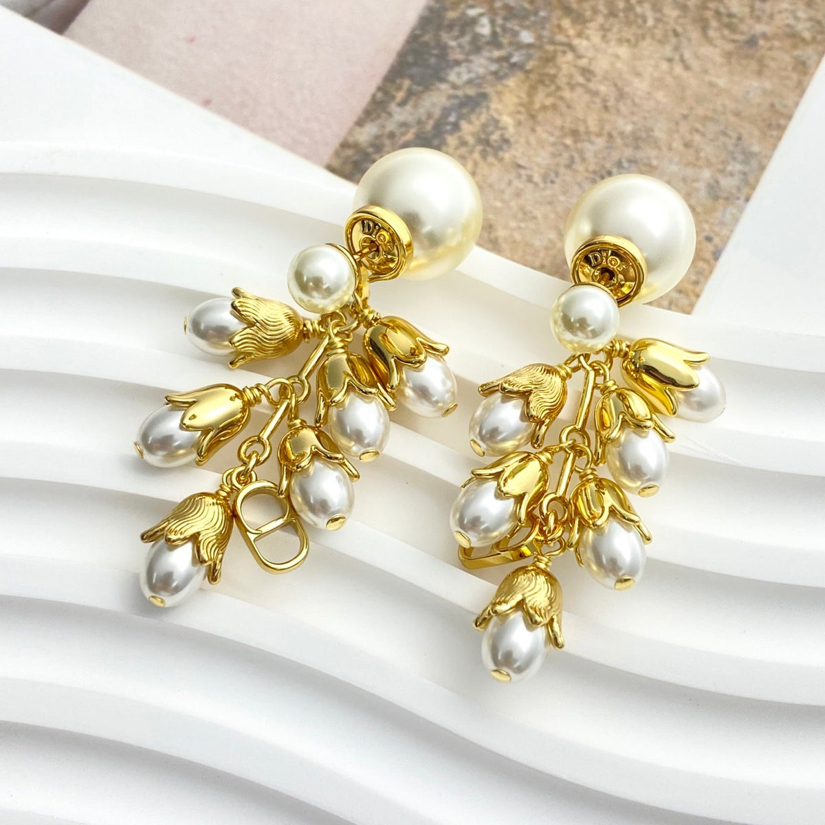 Martin Graham stud earrings in polished metal-tone