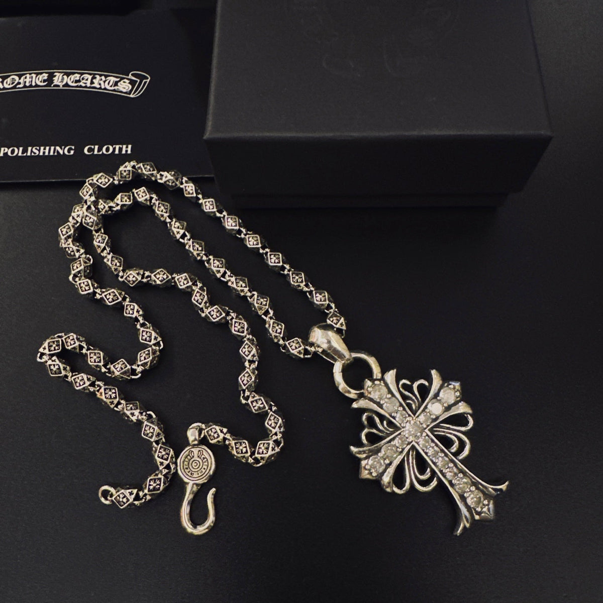 Martin Graham pendant necklace in polished metal-tone – close-up detail