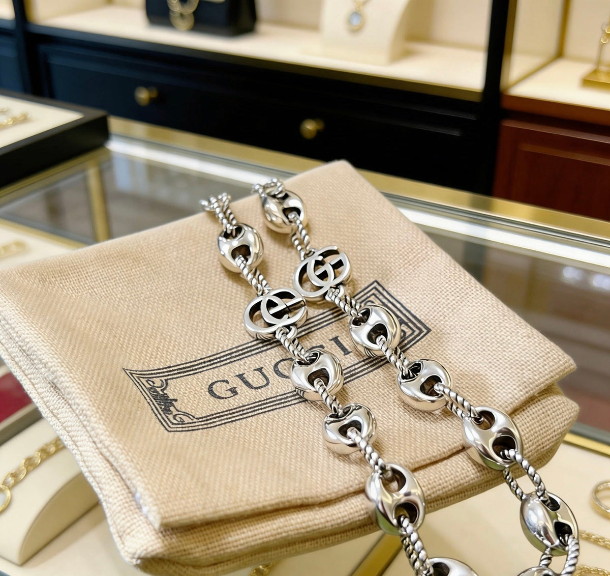 Martin Graham pendant necklace in polished metal-tone – close-up detail