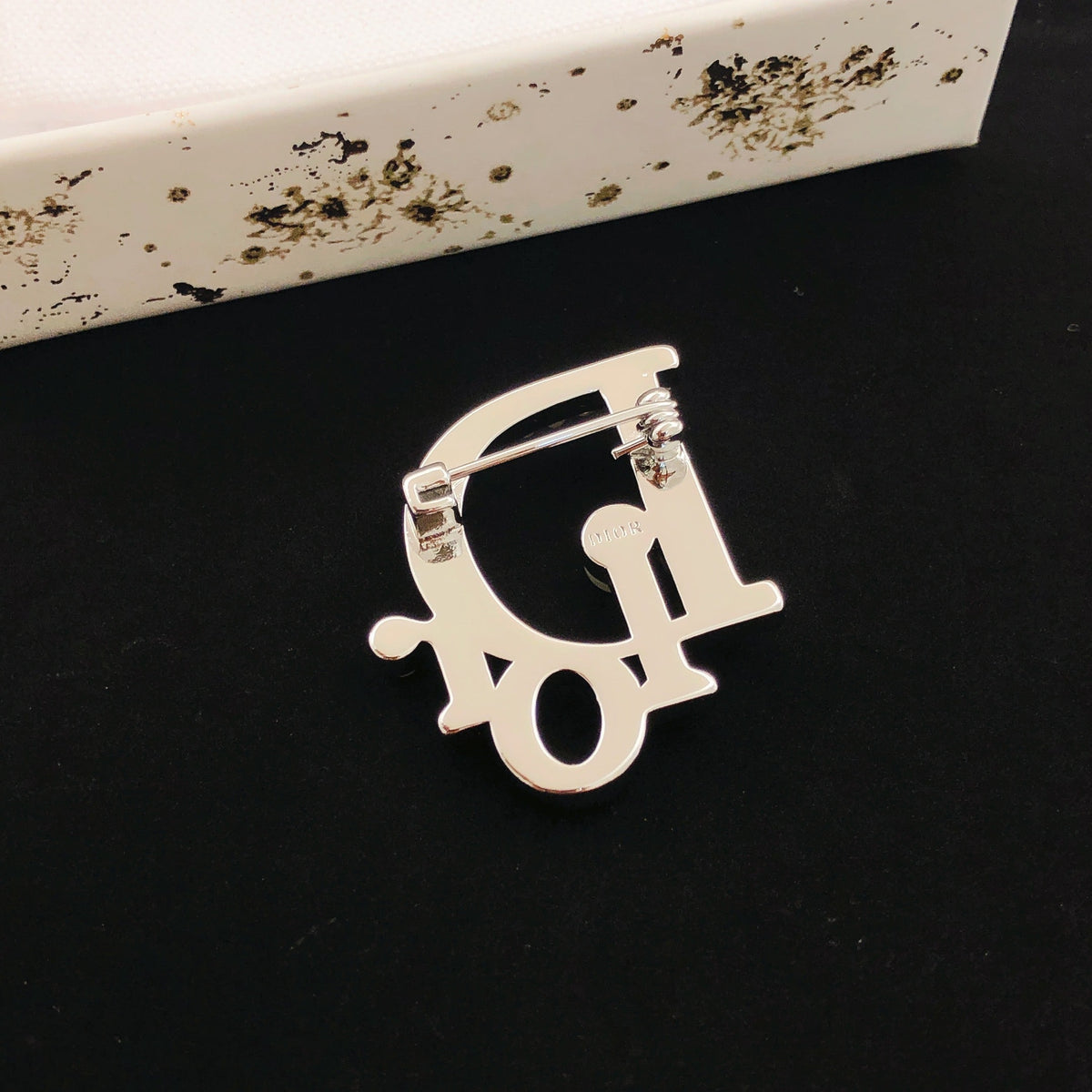 Martin Graham brooch in polished metal-tone