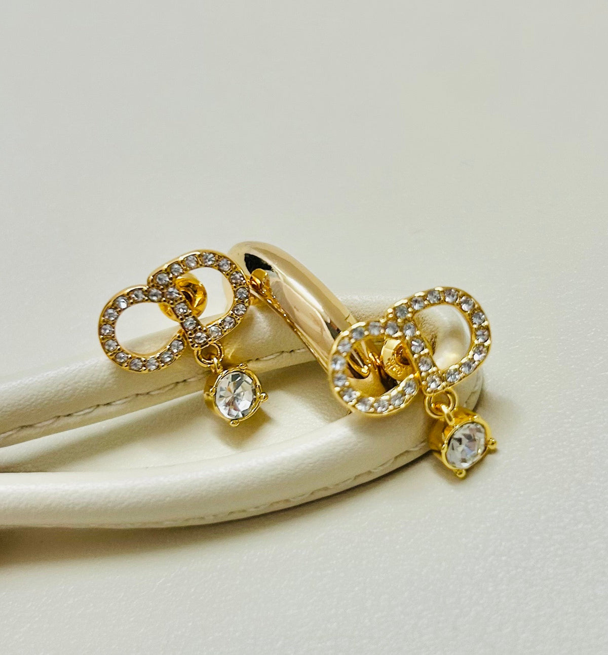 Martin Graham earrings in polished metal-tone