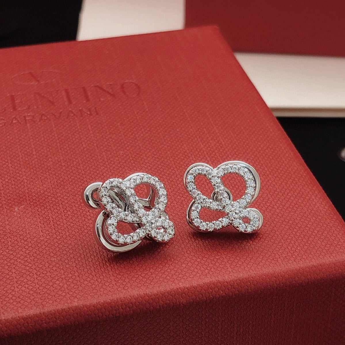 Martin Graham stud earrings in polished metal-tone