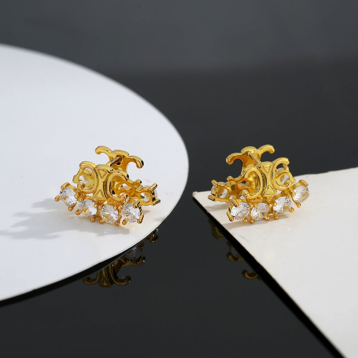 Martin Graham stud earrings in polished metal-tone