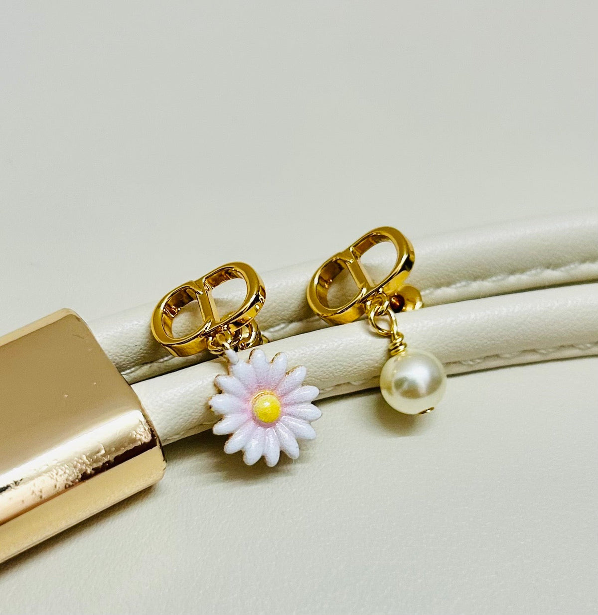 Martin Graham earrings in polished metal-tone