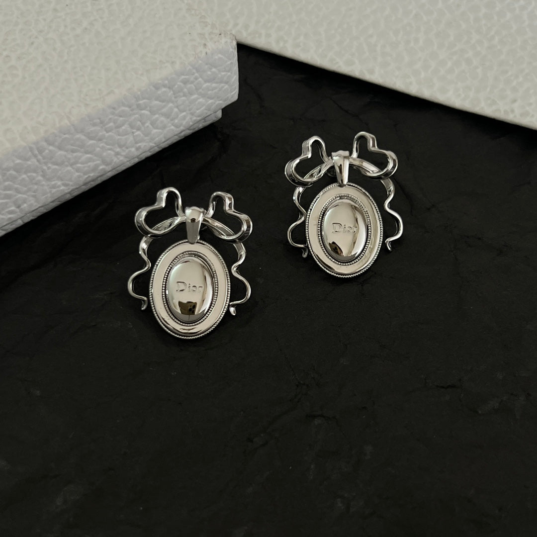 Martin Graham stud earrings in polished metal-tone