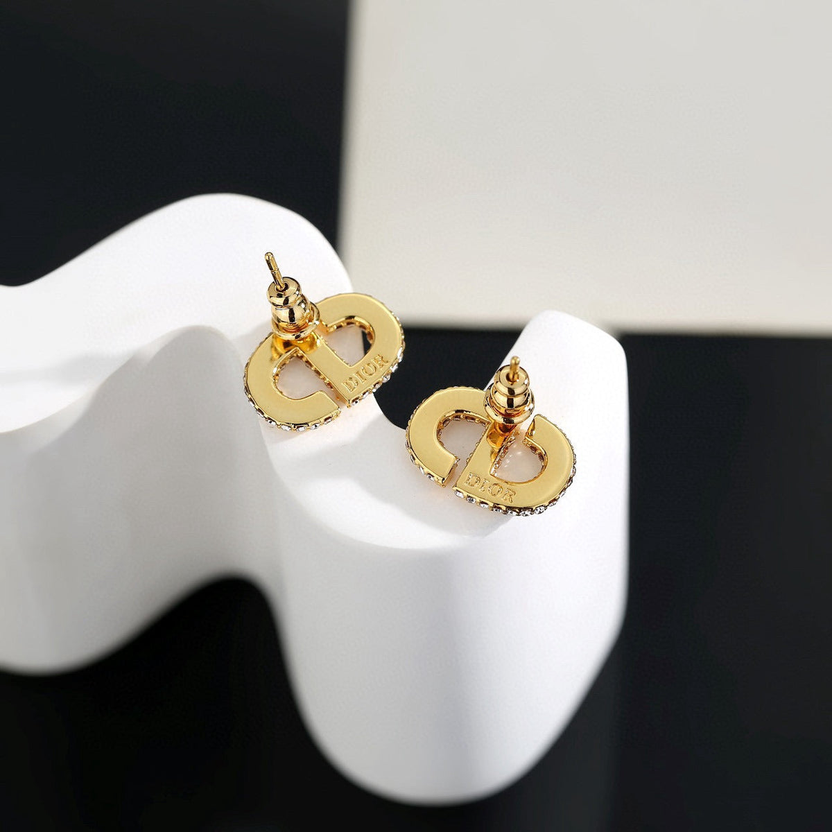 Martin Graham stud earrings in polished metal-tone