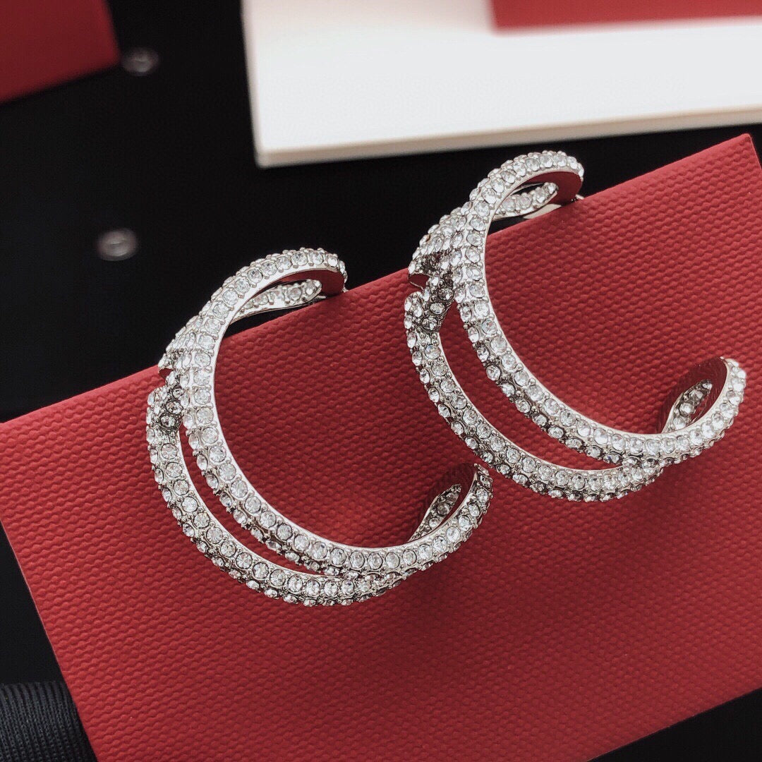 Martin Graham earrings in polished metal-tone