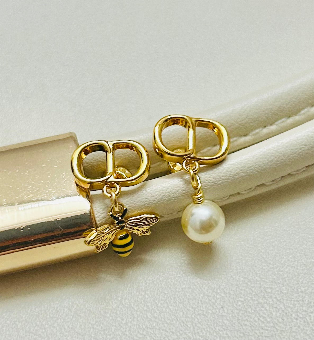 Martin Graham earrings in polished metal-tone