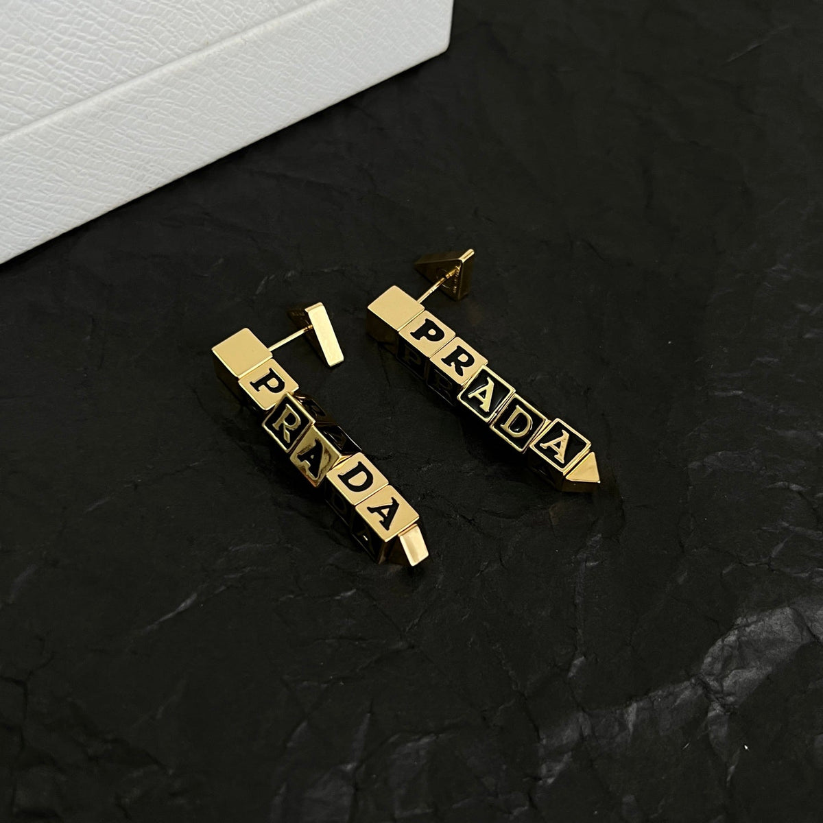 Martin Graham stud earrings in polished metal-tone