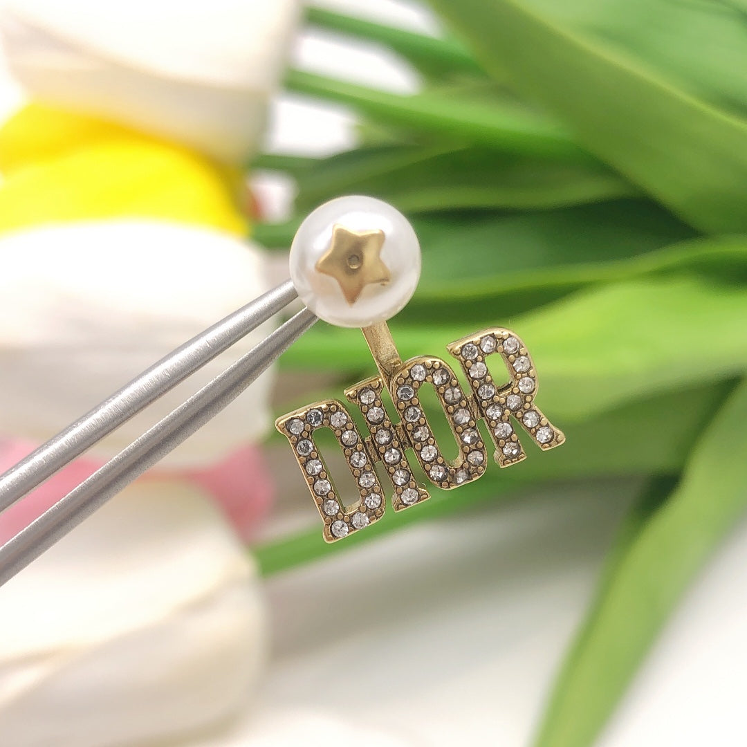 Martin Graham stud earrings in polished metal-tone