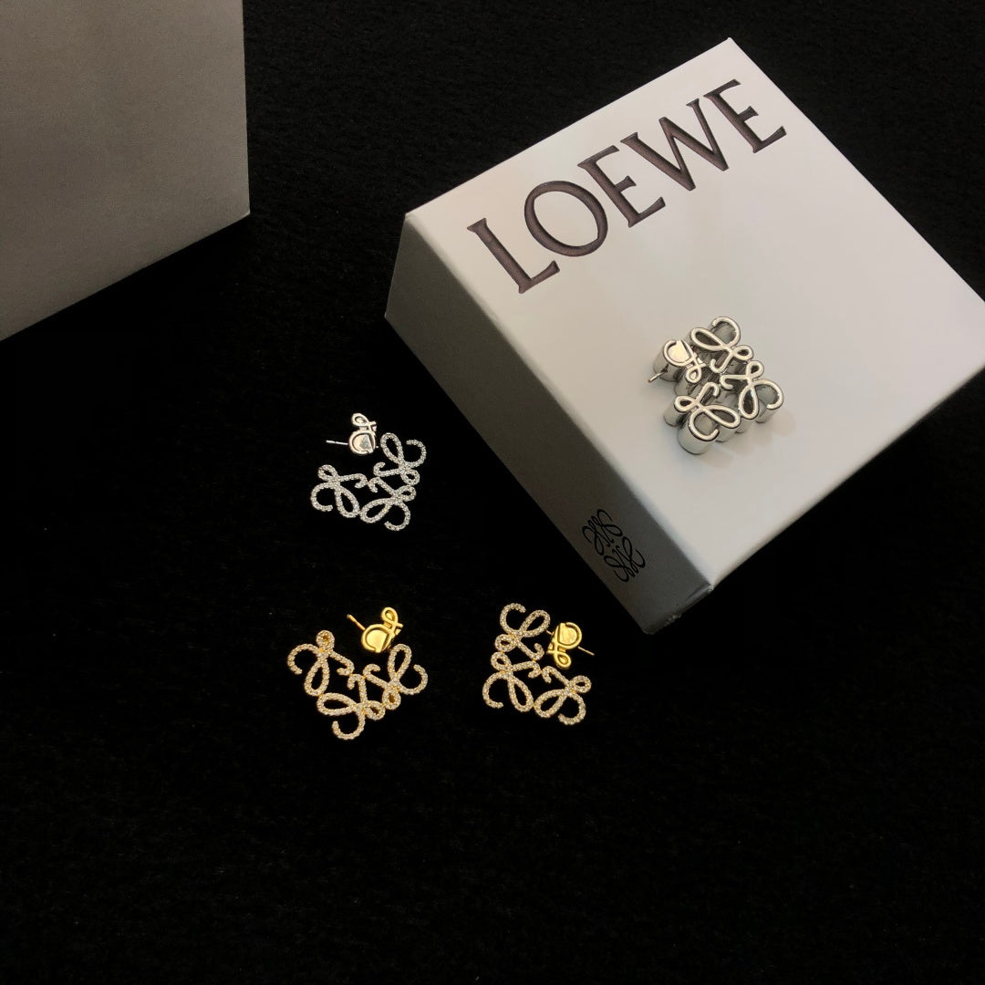 Martin Graham stud earrings in polished metal-tone