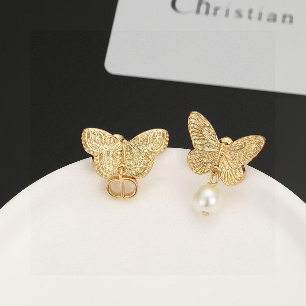 Martin Graham stud earrings in polished metal-tone