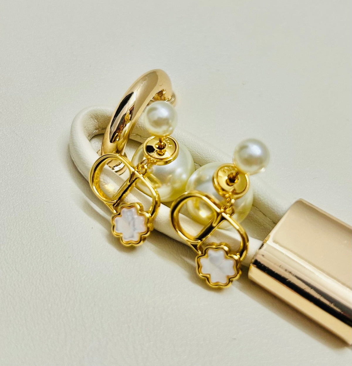 Martin Graham stud earrings in polished metal-tone