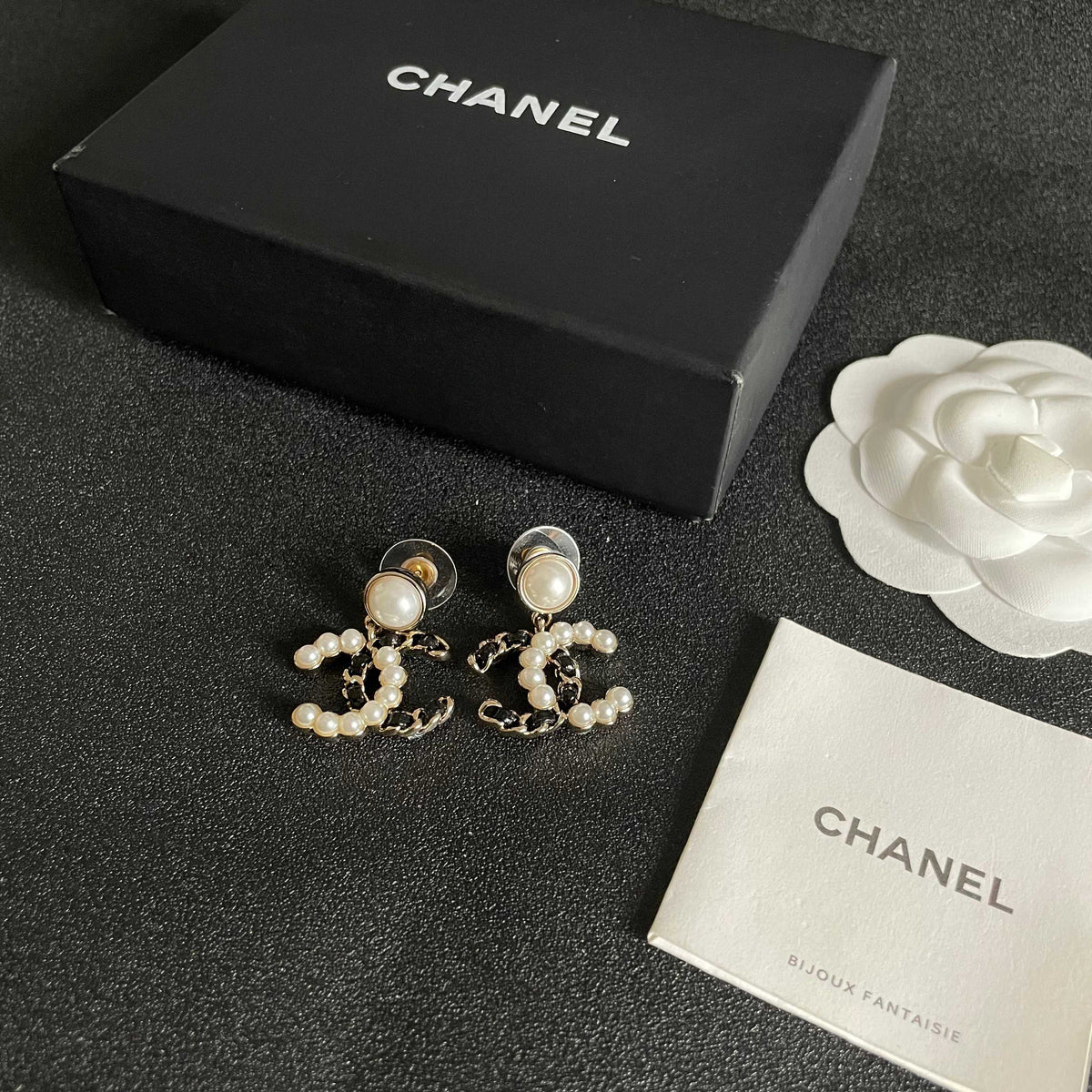 Martin Graham stud earrings in polished metal-tone – close-up detail