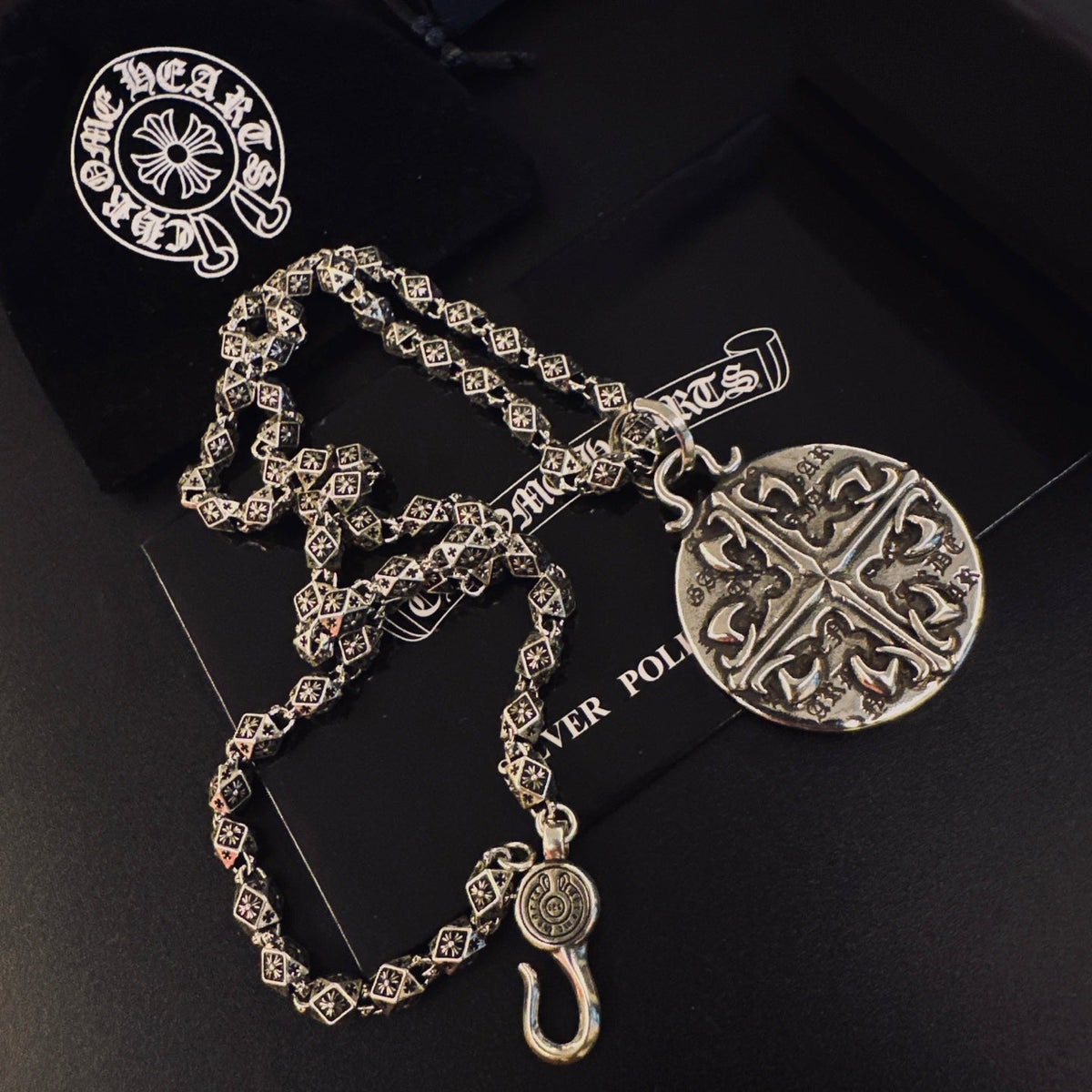 Martin Graham pendant necklace in polished metal-tone – close-up detail