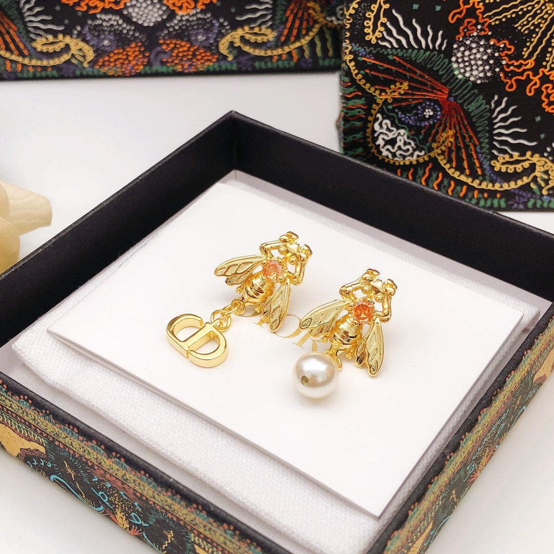 Martin Graham stud earrings in polished metal-tone