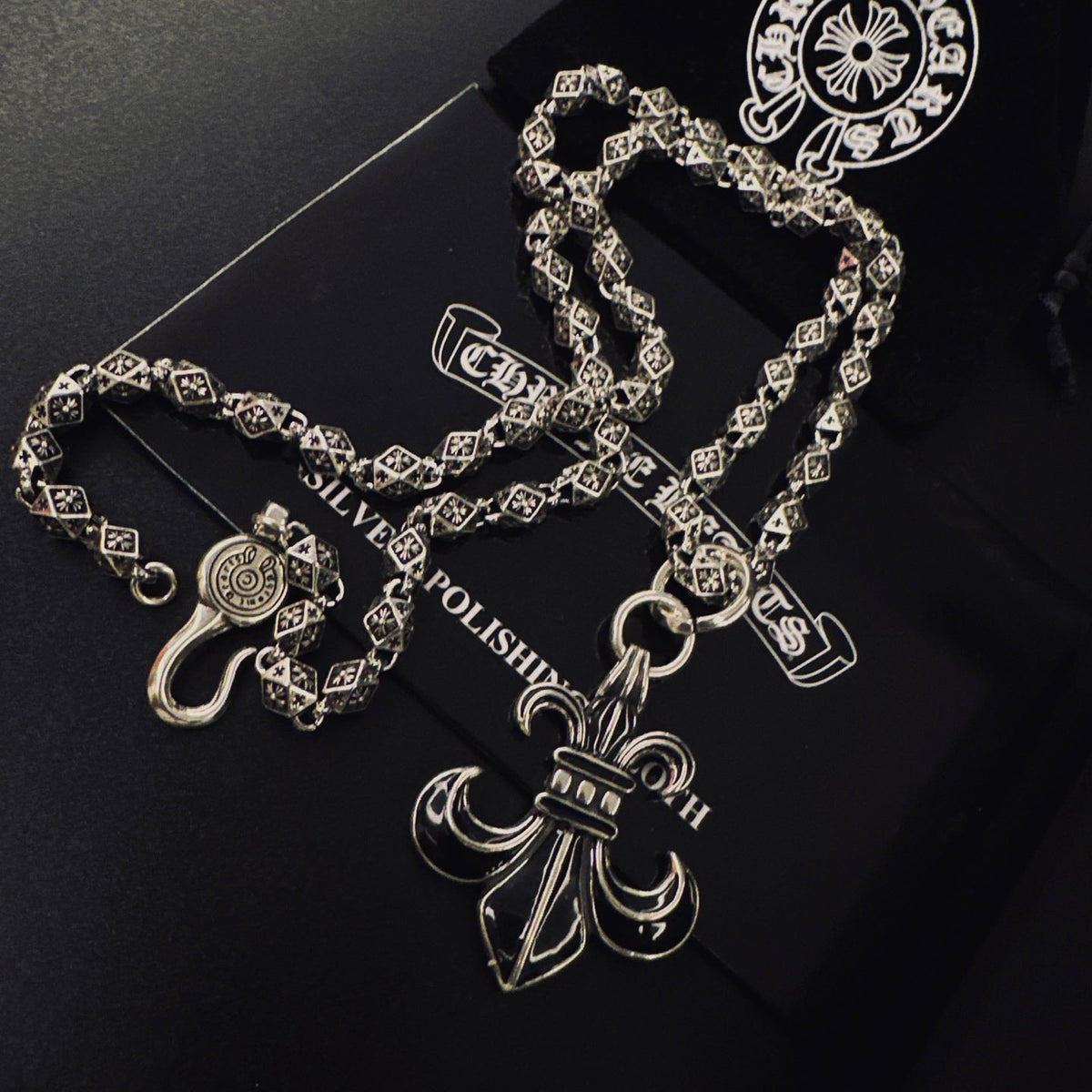 Martin Graham pendant necklace in polished metal-tone – close-up detail