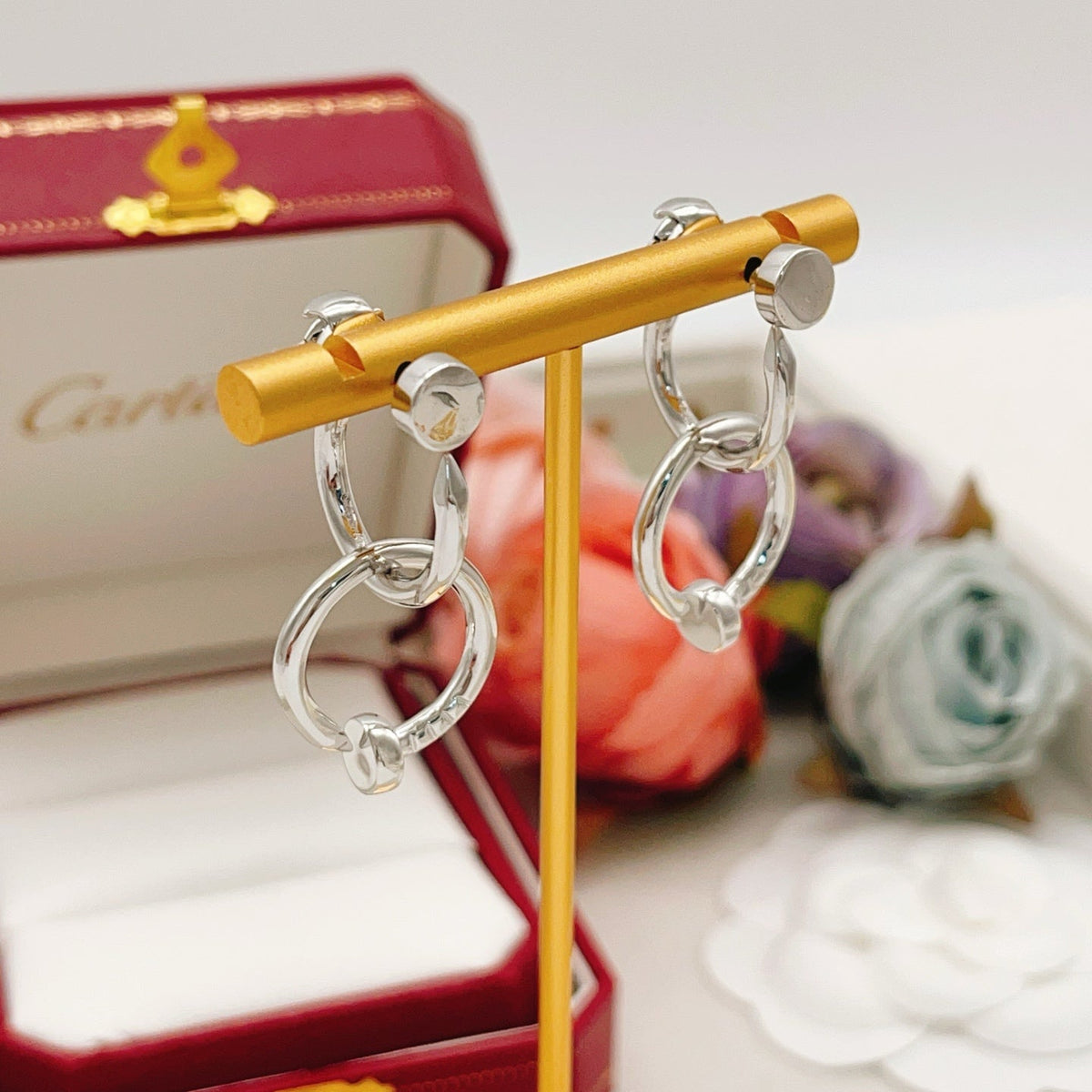 Martin Graham earrings in polished metal-tone
