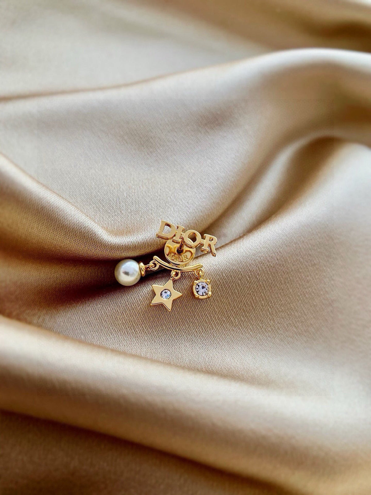 Martin Graham earrings in polished metal-tone