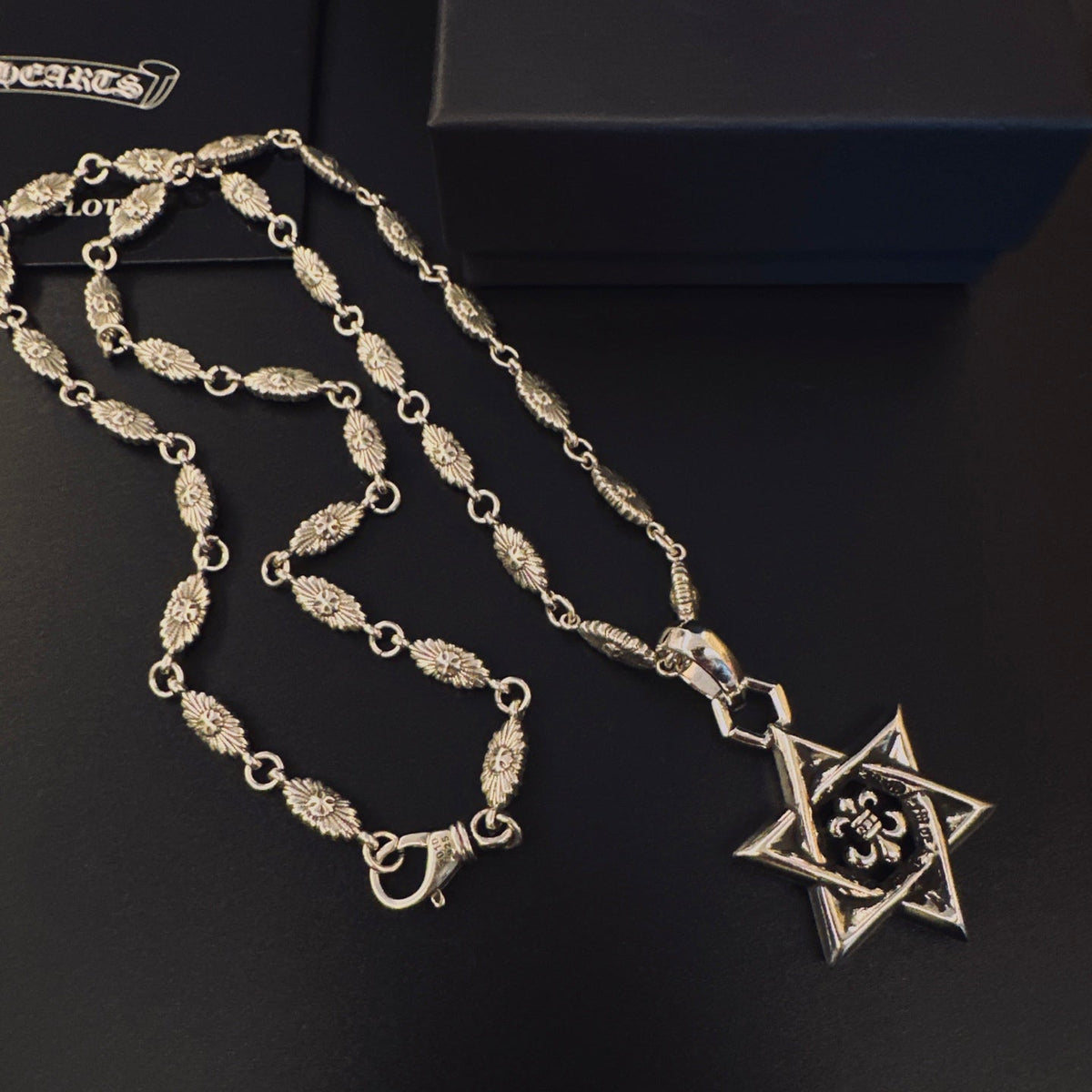 Martin Graham pendant necklace in polished metal-tone – close-up detail
