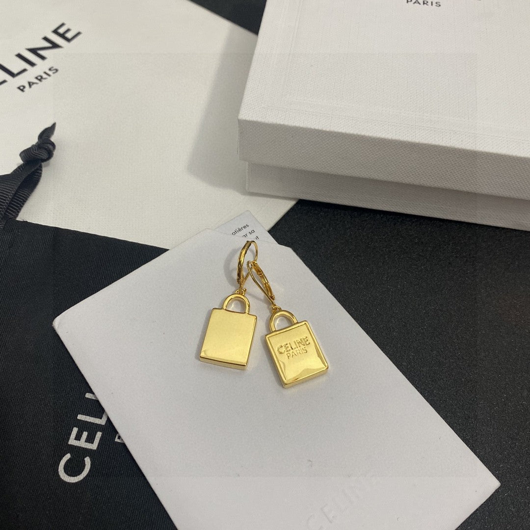 Martin Graham stud earrings in polished metal-tone