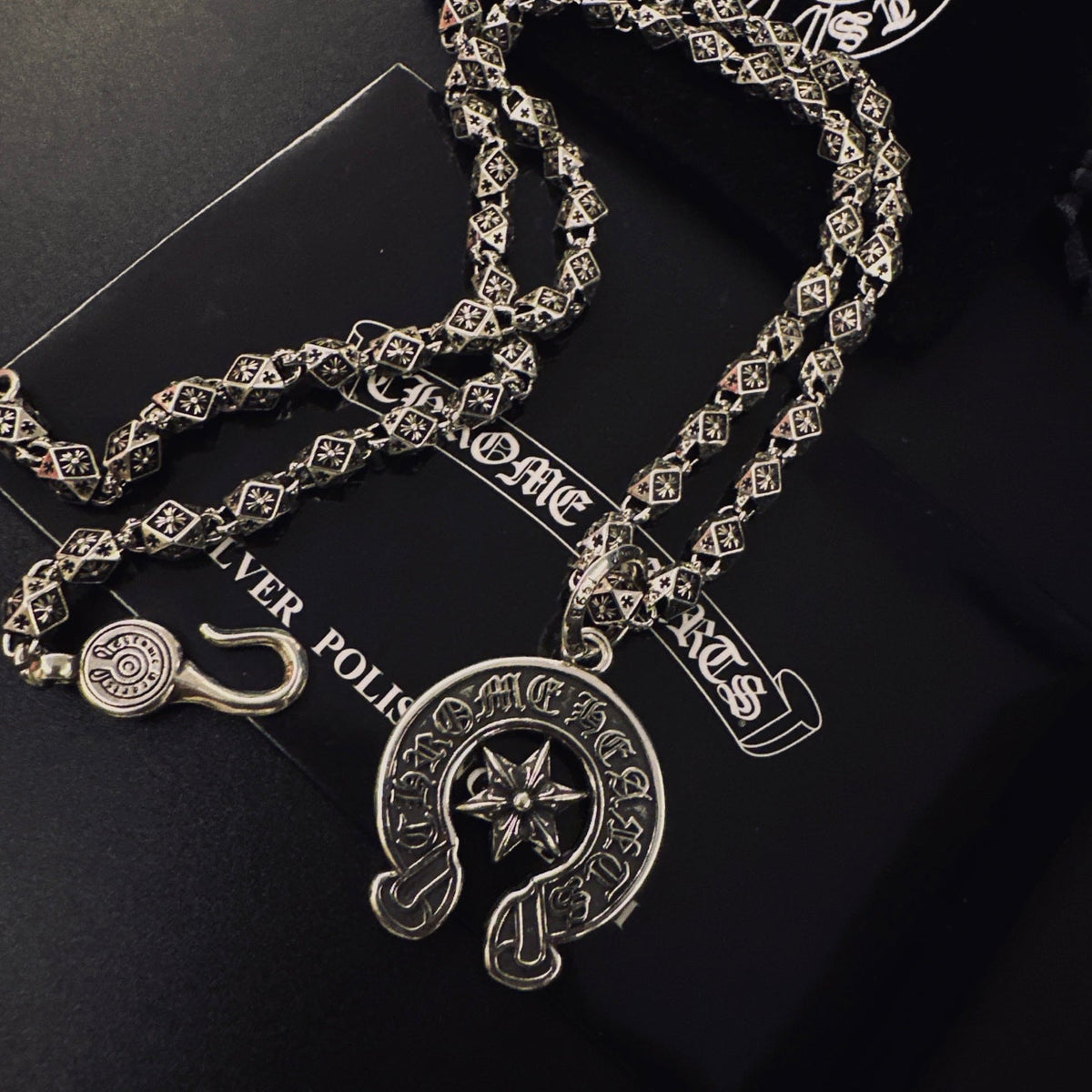 Martin Graham pendant necklace in polished metal-tone – close-up detail
