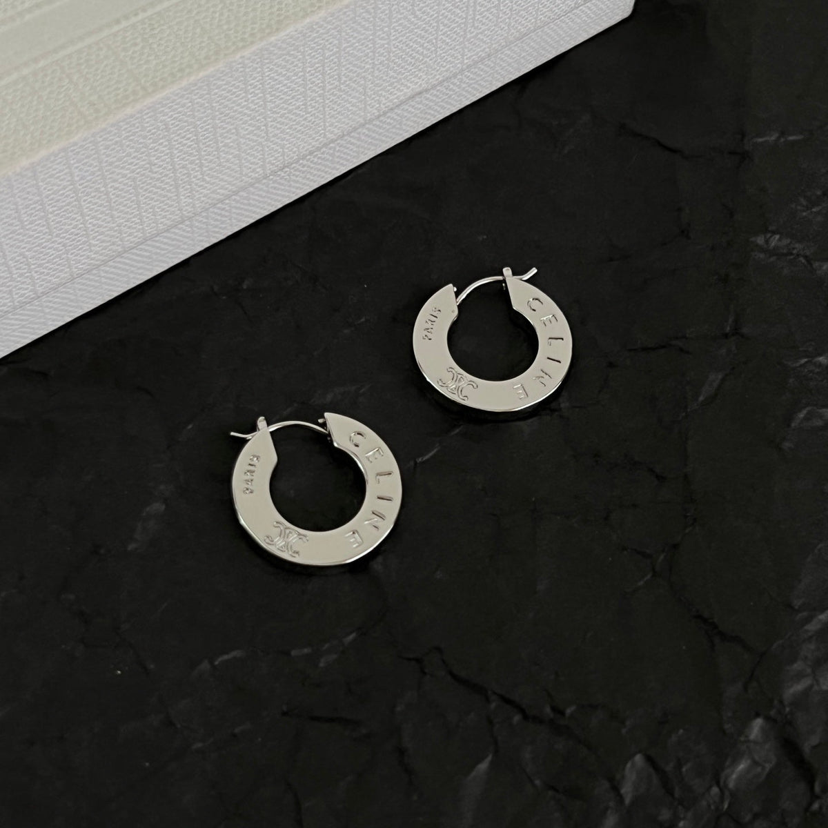 Martin Graham earrings in polished metal-tone