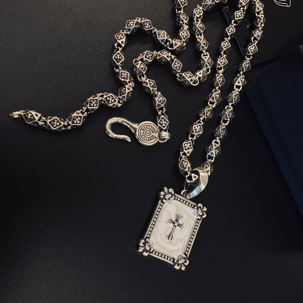 Martin Graham pendant necklace in polished metal-tone – close-up detail