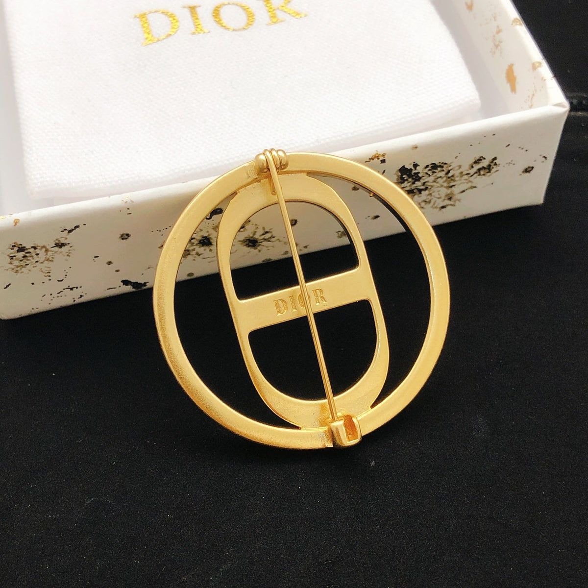 Martin Graham brooch in polished metal-tone