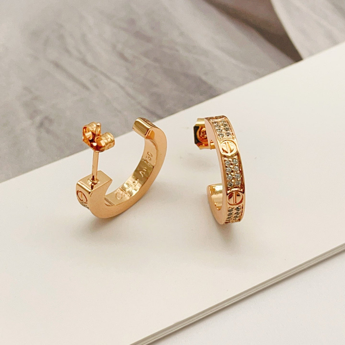 Martin Graham stud earrings in polished metal-tone