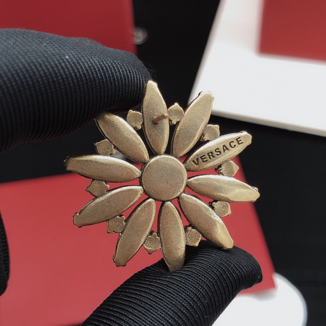 Martin Graham stud earrings in polished metal-tone – styled product view