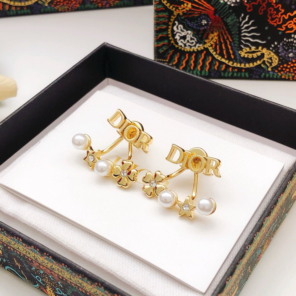 Martin Graham stud earrings in polished metal-tone