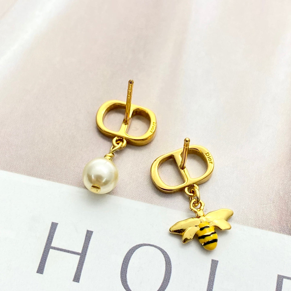 Martin Graham stud earrings in polished metal-tone