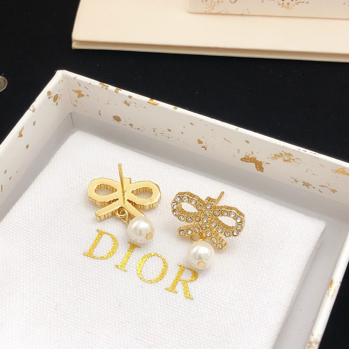 Martin Graham stud earrings in polished metal-tone
