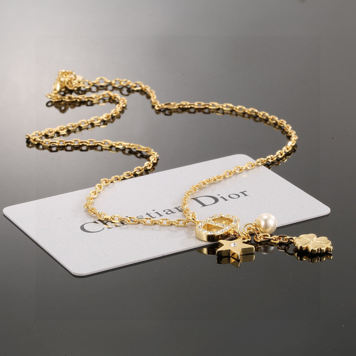 Martin Graham pendant necklace in polished metal-tone