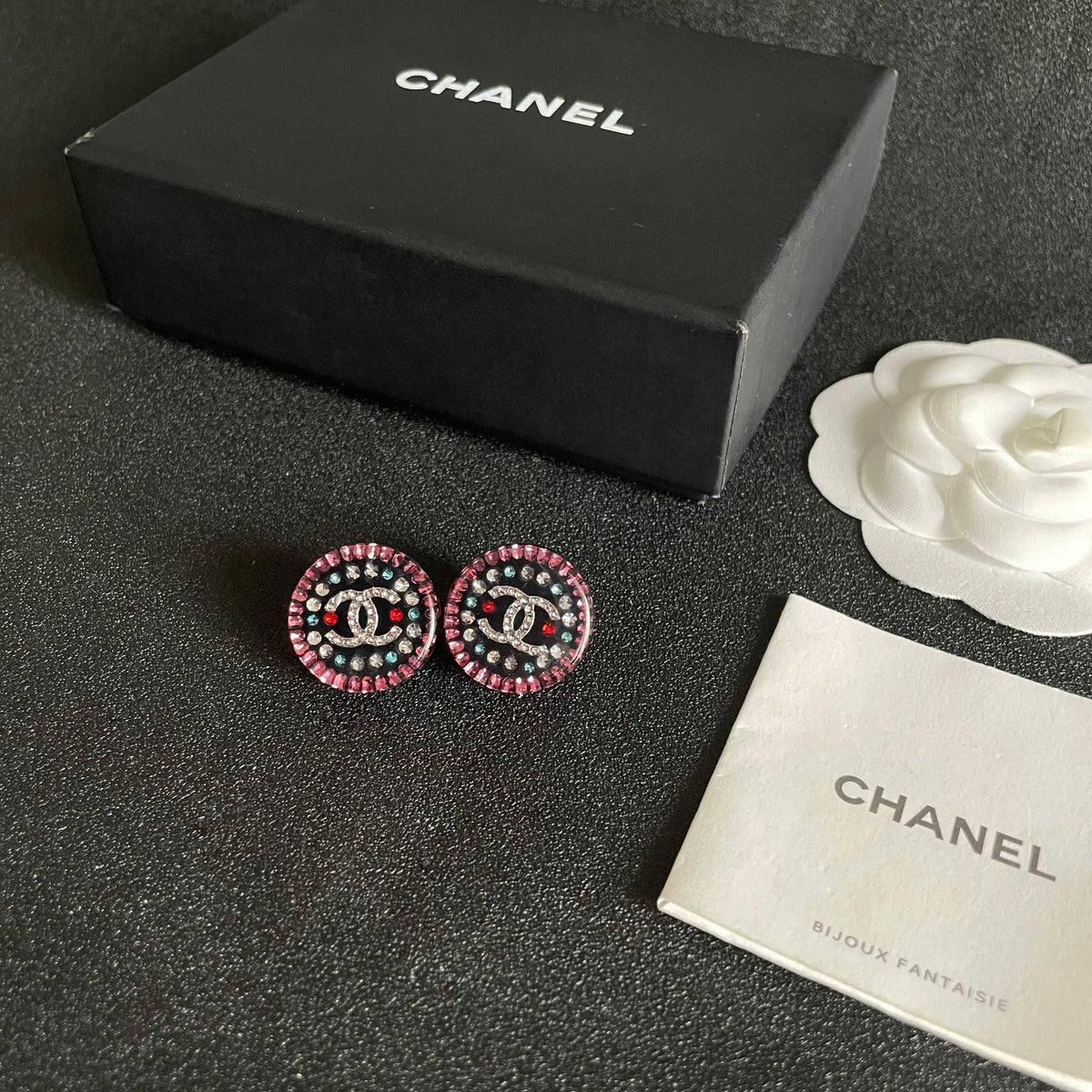 Martin Graham stud earrings in polished metal-tone – close-up detail