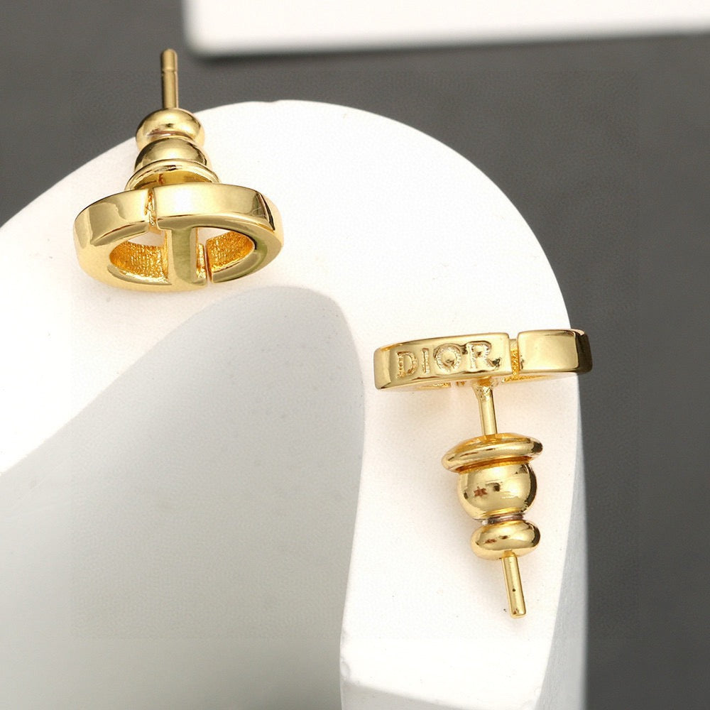 Martin Graham stud earrings in polished metal-tone