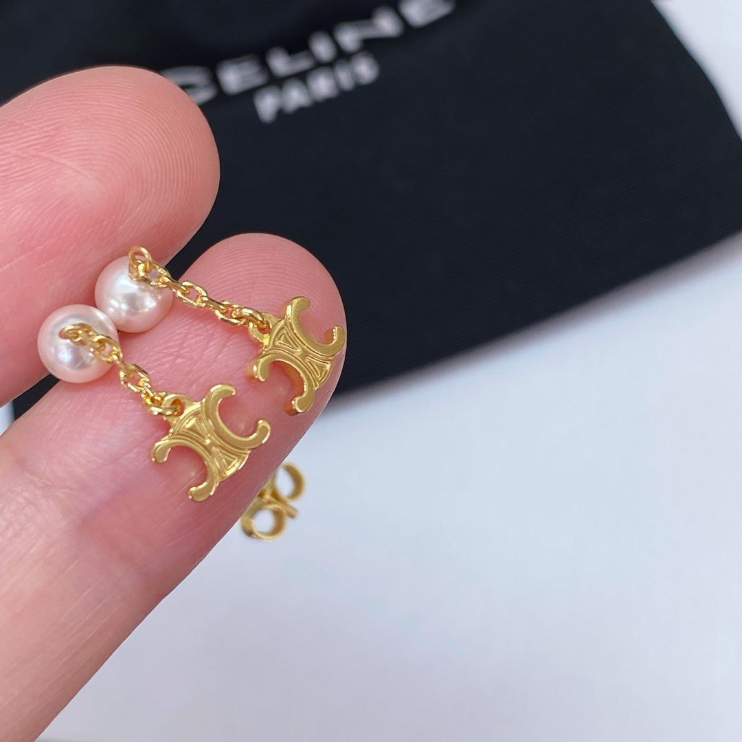 Martin Graham earrings in polished metal-tone