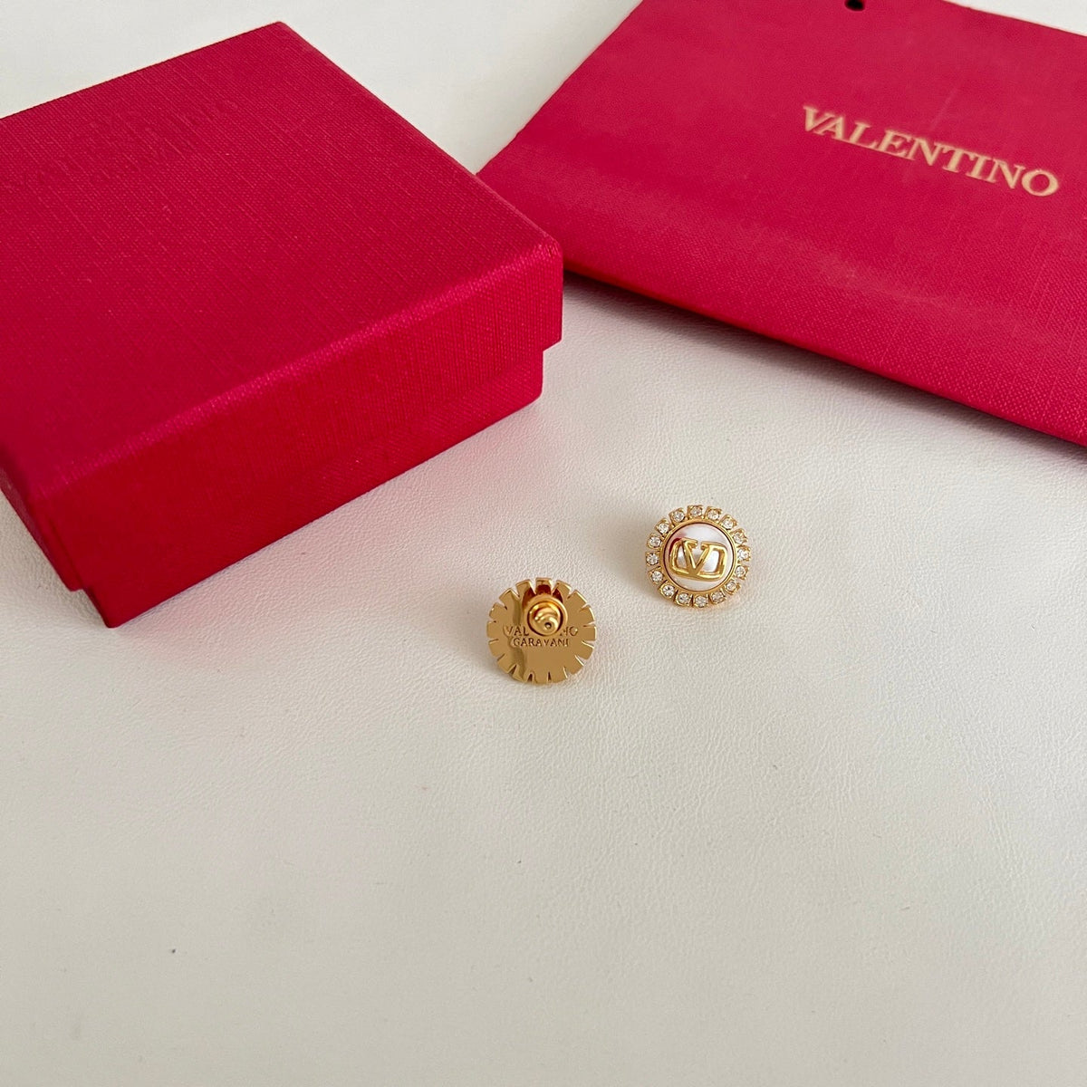 Martin Graham earrings in polished metal-tone