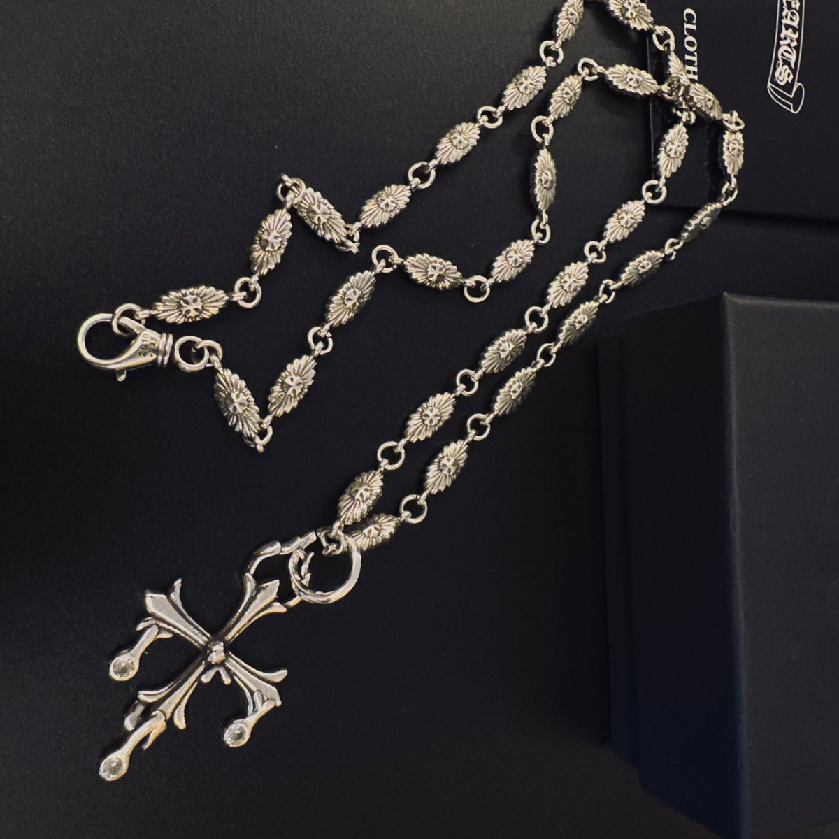 Martin Graham pendant necklace in polished metal-tone – close-up detail